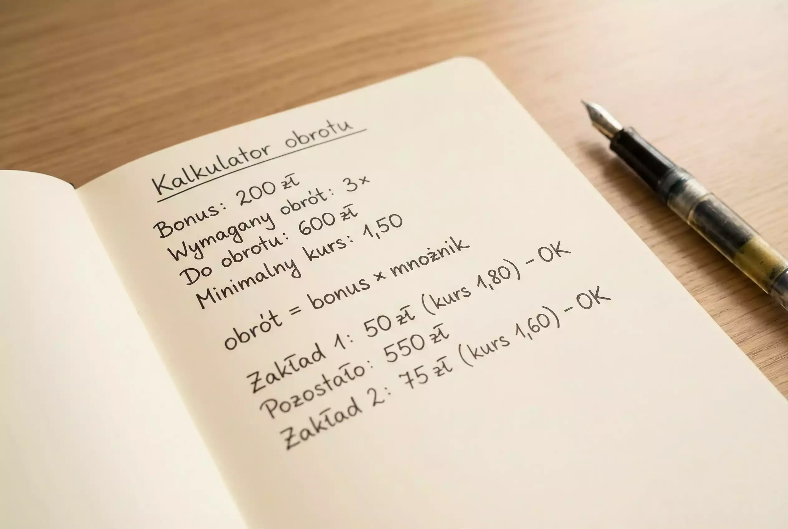 Kalkulator i notatnik z obliczeniami warunkΓ³w obrotu bonusem